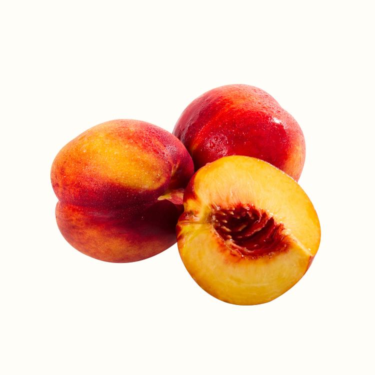 Close-up of ripe nectarines with smooth red-and-gold skin