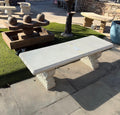 Ivory carved stone garden bench with ornate supports, actual product photo